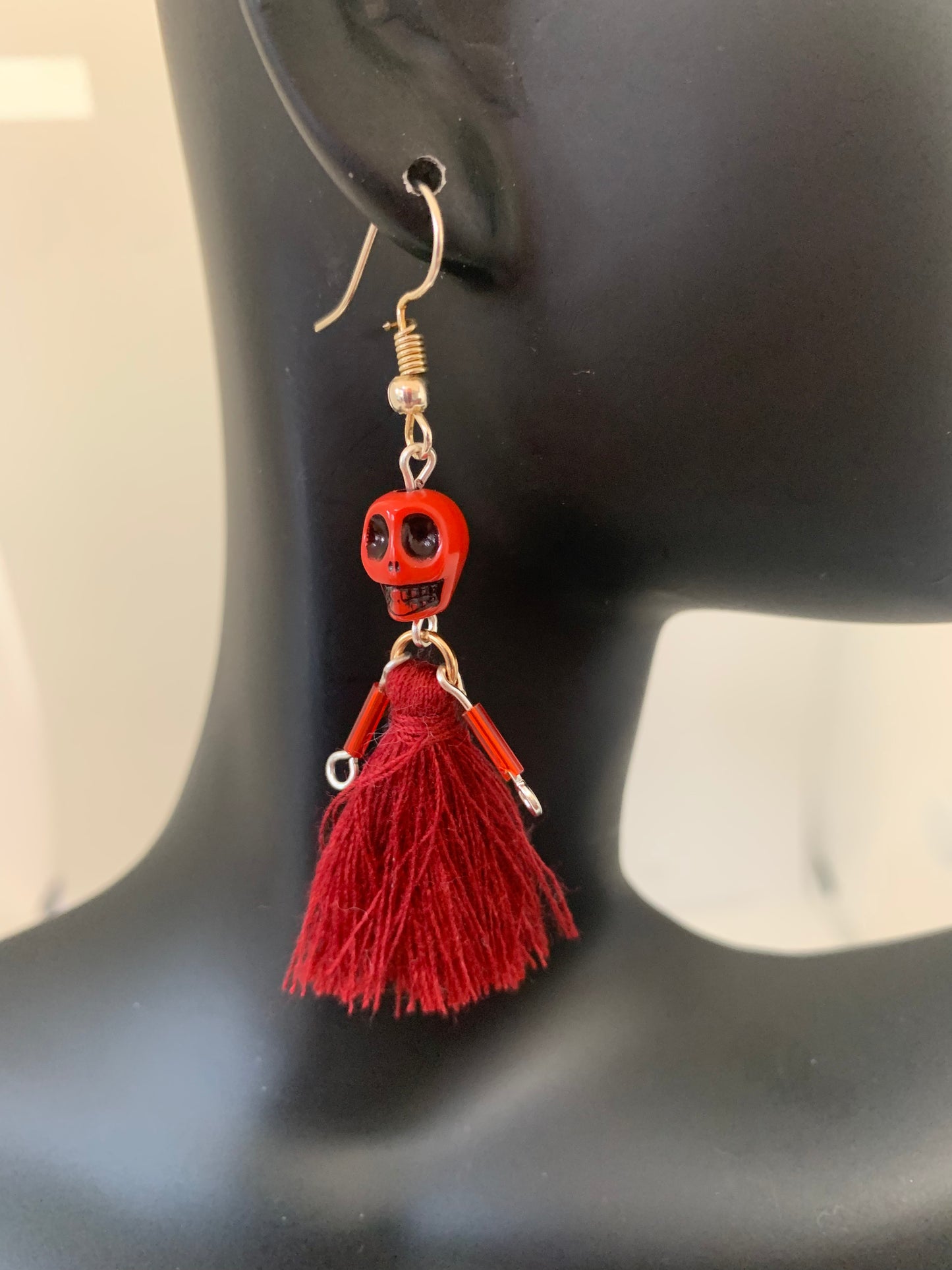 God skeleton doll earring